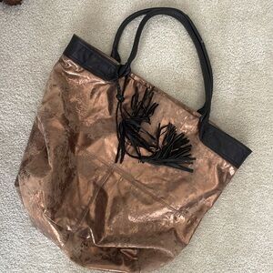 Oversized brown metallic tote with leather tassel